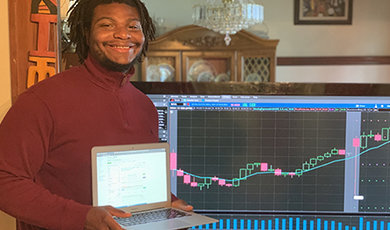 Petroy Thompson shows how he monitored stocks from home.