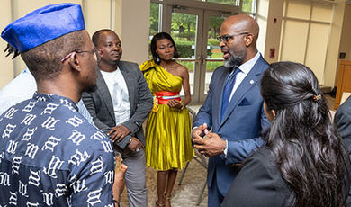 Travis Adkins speaks with a group of Mandela fellows.