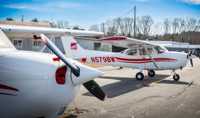 Two planes sit on the ramp.