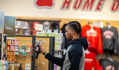 A student browses for merchandise in the bookstore.