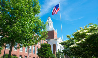 photo of Boyden Hall surrounded by green and flowering trees