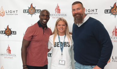 Devin McCourty, Caroline Tripp and Matt Light pose for a photo 