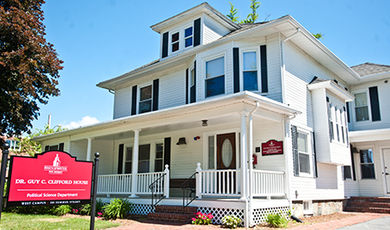 The exterior of the Clifford House, a home with white siding.