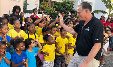 BSU President Fred Clark high-fives a group of ELL CV students.