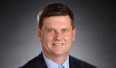 Headshot of Jim Dunphy with a black and white background