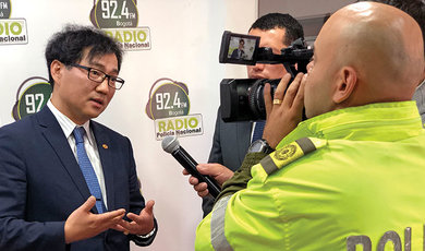 Dr. Choi is interviewed by Columbia National Police Radio & Television
