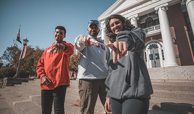 Tyler, Jim and Mya Lamonte pose for a photo in front of Boyden Hall.