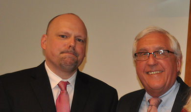 Brian Frederick and Michael Kryzanek stand for a photo.
