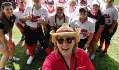 Mary Beth Lamb poses with softball team 