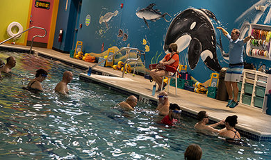 BSU students help Parkinson's patients exercise in a pool.