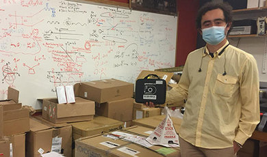 Dr. Samuel Serna with photonics equipment