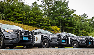 Three BSU police cars parked in a lot