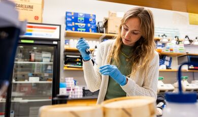 Olivia Quintin works at a lab station.