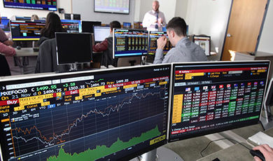 Students use special computers to access current financial information.