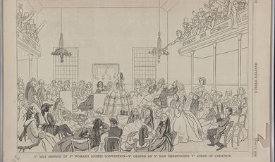 Print shows a group of women in a hall listening to a woman speaker who is pointing to the men sitting in an upper gallery.