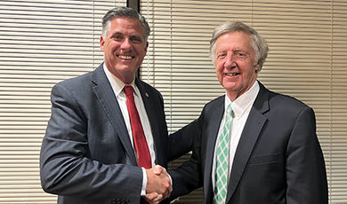 Michael Taylor shakes hands with President Clark.