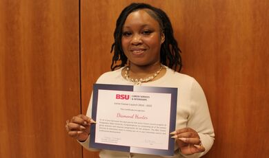 Diamond Hunter holds a certificate.