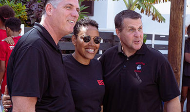 Zita Vieira Mendes, wearing a black polo poses with members of BSU Cabo Verde visit