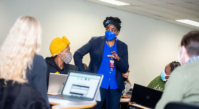 Dr. Castagna Lacet leading a discussion in her community organization class