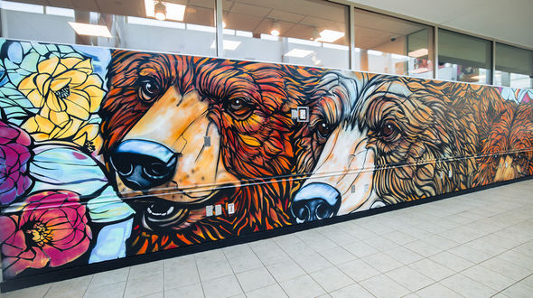 The finished mural in East Campus Commons shows three bear faces.