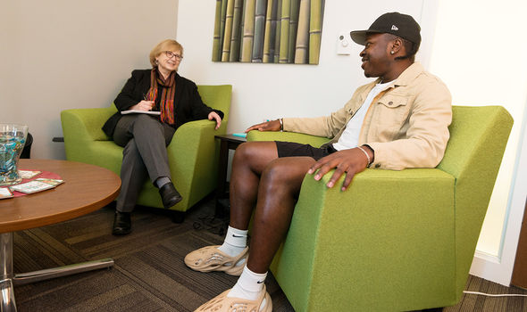 A student sits and talks with a Counseling Center counselor