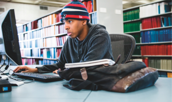 student at library