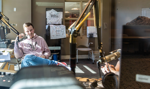 a DJ speaks into a microphone in BSU's WBIM radio station