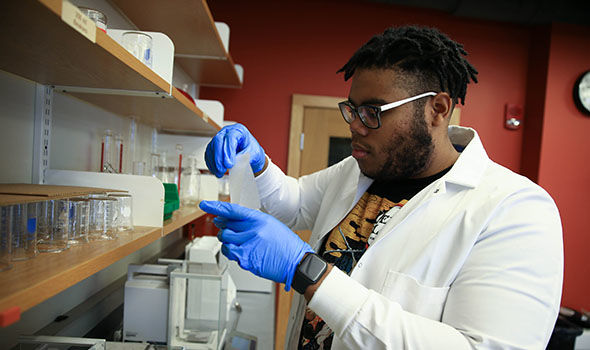 BSU chemistry student Fegens Lyncee working in a lab