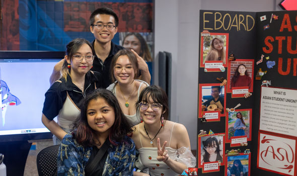 5 members of BSU student group Asian Student Union at a table during Student Involvement Fair