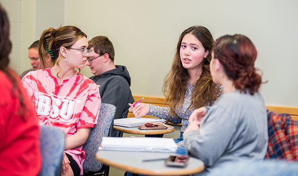 A group of students in a discussion in their Cultural Diversity in School and Society class