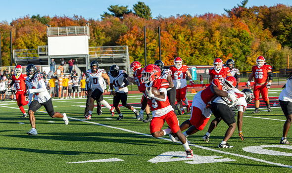 a BSU football player runs the ball down the field at Homecoming 2025