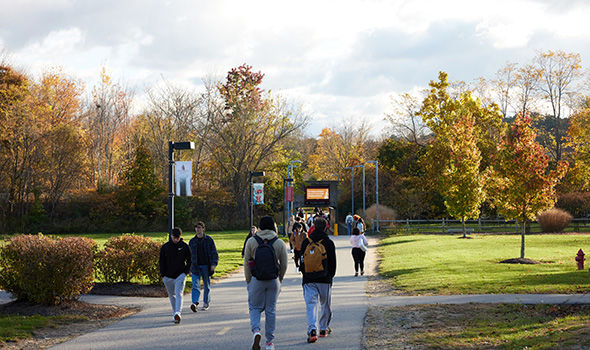 Students walking on the path connection east campus and west campus