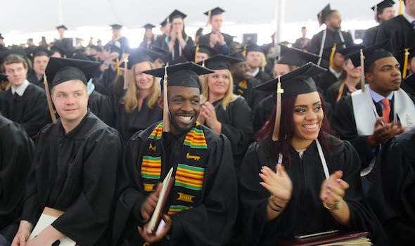 Students clap at commencement
