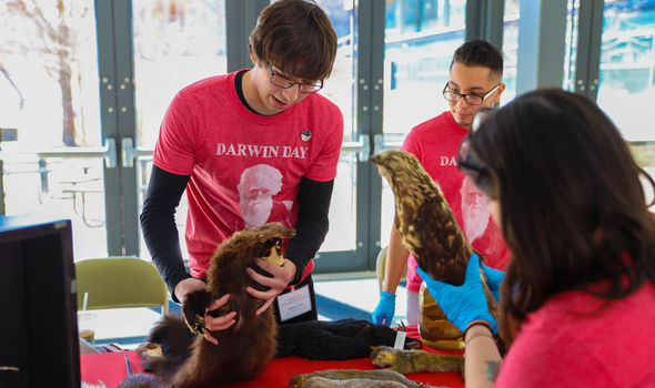 students displaying different animals at Darwin Day 2020