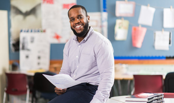 Daniel Estime, BSU Secondary Education graduate in the classroom he teaches in