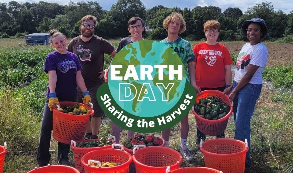 Students at Sharing the Harvest Community Farm holding baskets of harvested produce and looking at camera. Text reads "Earth Day Service Project: Sharing the Harvest"