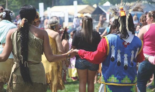 People holding hands at the Embarkation Festival