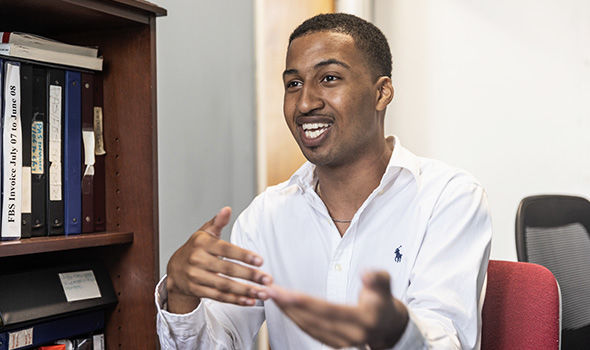 Mariojardel Centeio talks animatedly at his internship