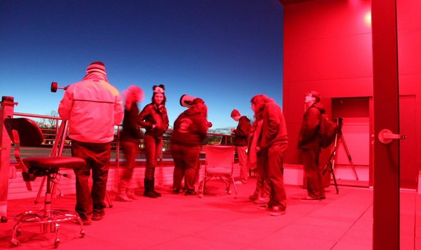 people on observatory deck in evening