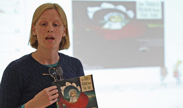 a BSU graduate student giving a presentation in class