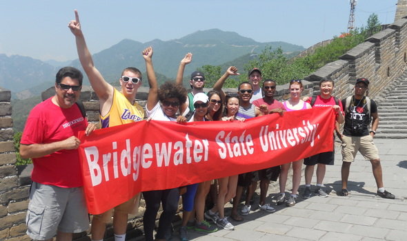 BSU students, faculty and staff on the Great Wall of China holding a BSU banner
