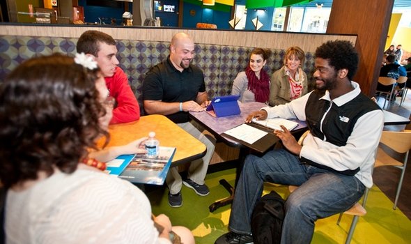 ICEI Home.jpg ICEI students and staff around a table