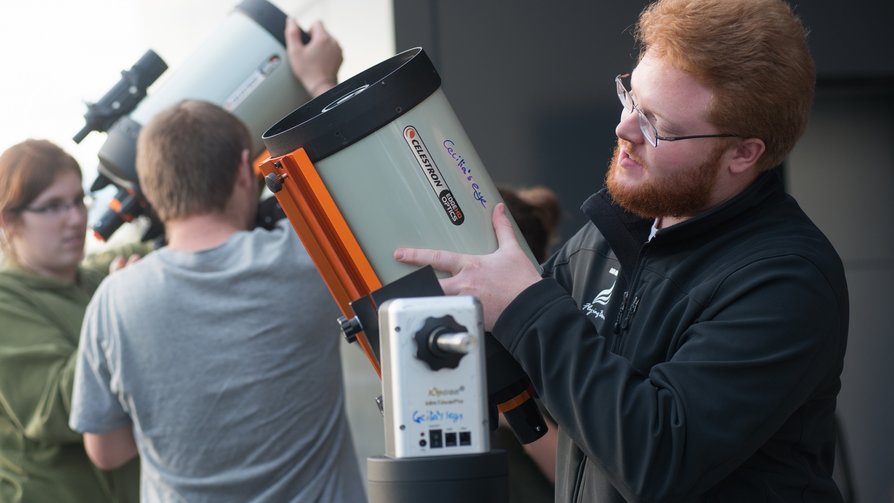 students setting up telescopes