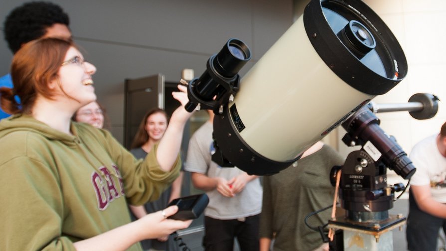 students using telescope