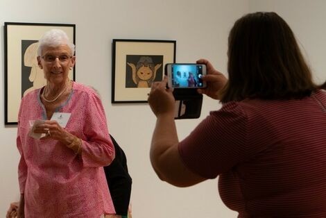 Ellen Farren poses for a photo with her collection.
