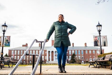 Dr. Wendy Williams stands on top of stairs near Boyden Hall