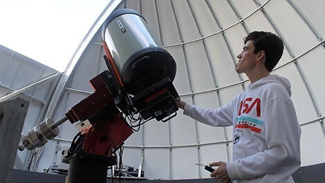 Antu Stettler adjusts a telescope in BSU's observatory.