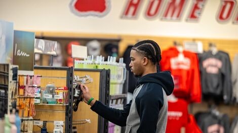 A student browses for merchandise in the bookstore.