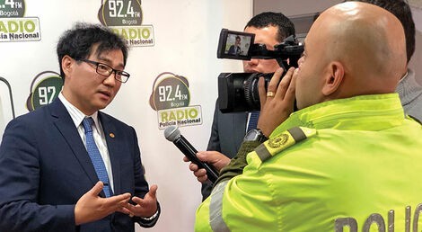 Dr. Choi is interviewed by Columbia National Police Radio & Television