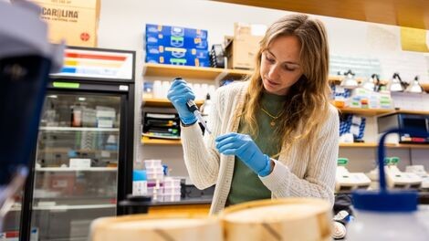Olivia Quintin works at a lab station.